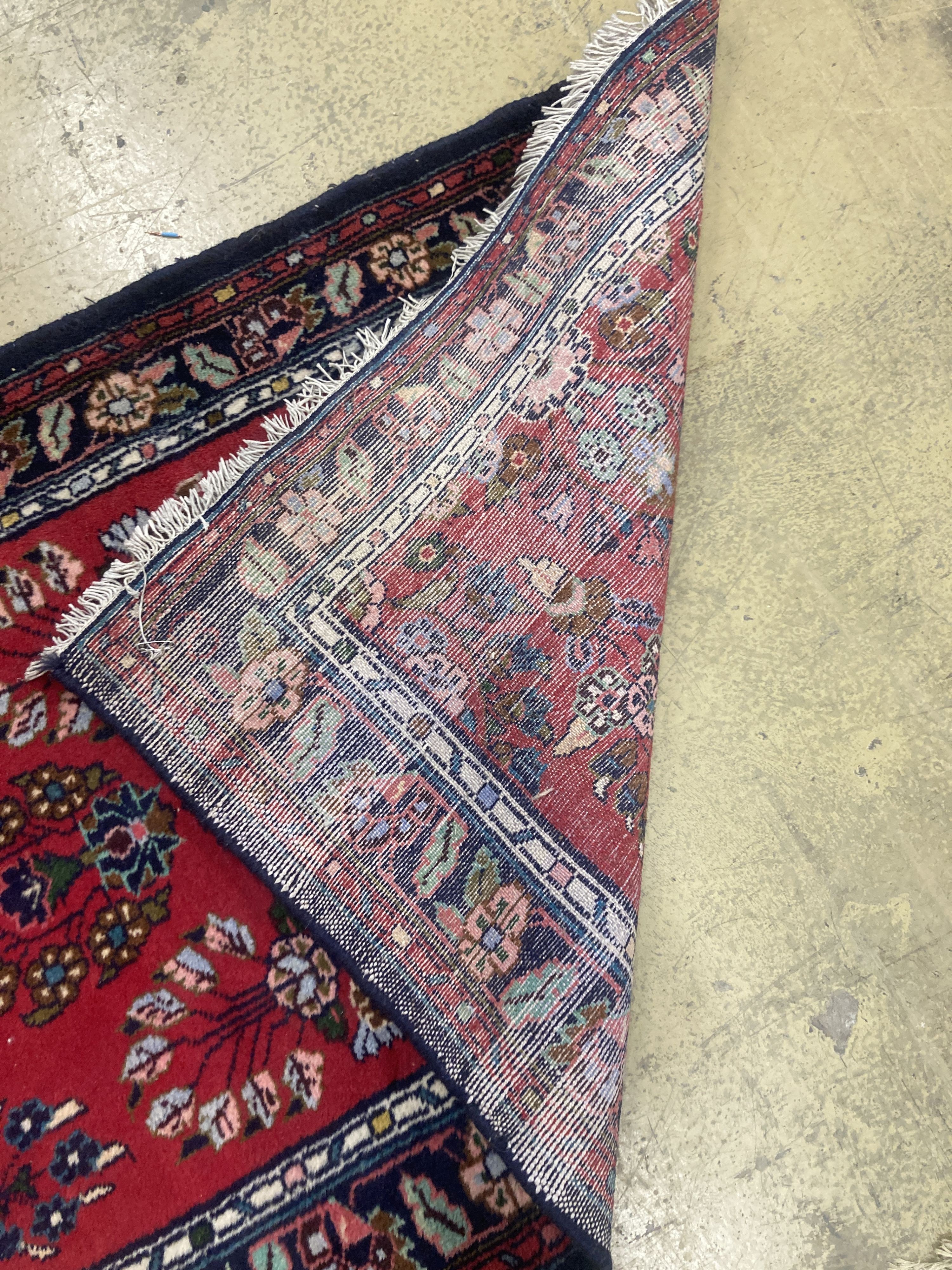 A Hamadan red ground runner with floral design, 280 x 84cm